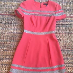 Worn once to a wedding, beautiful orange/red 100% polyester Lace dress.